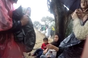 Independent volunteers distributing bin bags at Moria